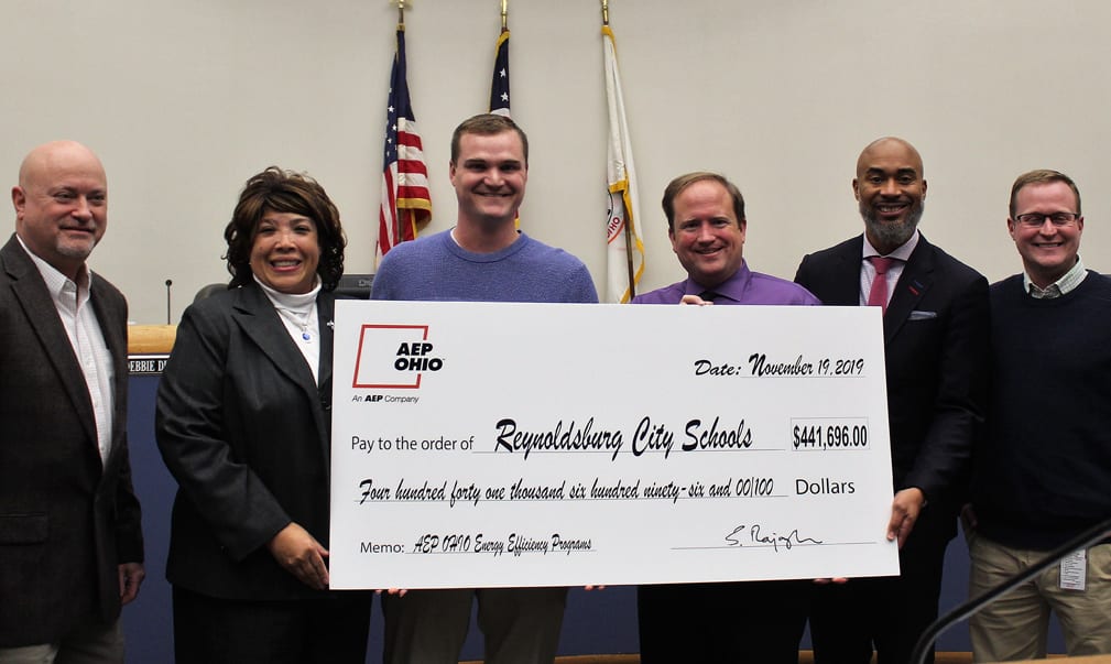 Sean Weber presenting a check to Reynoldsburg City Schools for $400k.