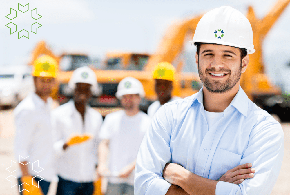 Veregy crew with logo and bokeh Veregy work crew on a jobsite wearing Veregy hard hats.